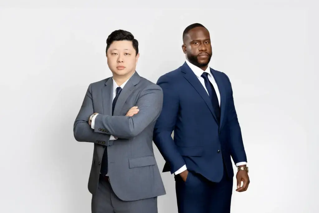 Attorneys Chester Uzoma and Nathan Sudarma, partners at the Uzoma Sudarma personal injury and estate law firm in Sugar Land, Texas.